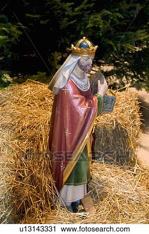 Scene of king bringing gifts to Jesus in the manger View Large Photo Image Stock Image - Scene of king bringing gifts to Jesus in the manger. Fotosearch