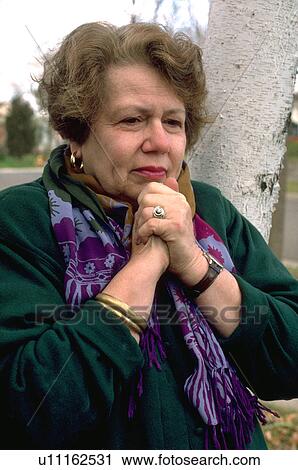 Woman grieving loved one View Large Photo Image Stock Image - Woman grieving loved one. Fotosearch