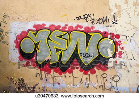 Stock Image - Colorful graffiti on building wall. Fotosearch