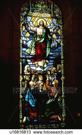 Stock Image - Jesus ascending into heaven on stained glass. Fotosearch
