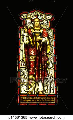 Stock Photography - Jesus in red robe on stained glass window. Fotosearch