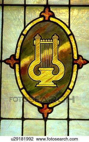 Lyre or harp on stained glass window View Large Photo Image Stock Image - Lyre or harp on stained glass window. Fotosearch
