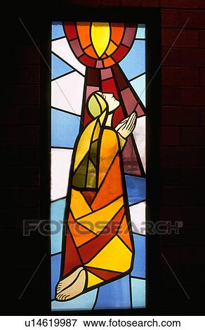 Stained glass window with Mary praying View Large Photo Image Stock Photo - Stained glass window with Mary praying. Fotosearch
