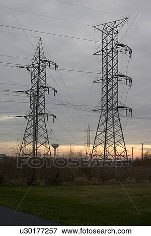 Power lines at sunset View Large Photo Image Stock Photo - Power lines at sunset. Fotosearch