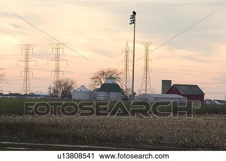 Power lines running through farm View Large Photo Image Stock Image - Power lines running through farm. Fotosearch