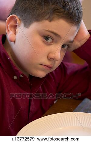 Defiant and Hungry Young Boy View Large Photo Image Stock Photo - Defiant and Hungry Young Boy. Fotosearch