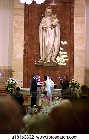 Saying vows at Polish Catholic wedding View Large Photo Image Stock Image - Saying vows at Polish Catholic wedding. Fotosearch