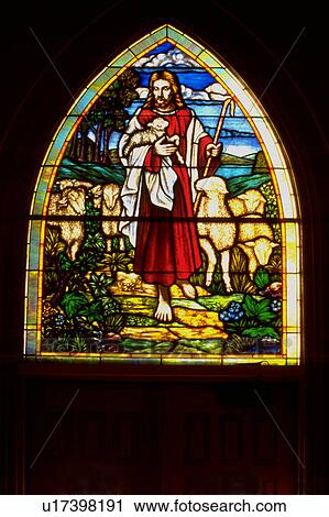 Stock Image - Stained glass window of Jesus the Good Shepherd. Fotosearch