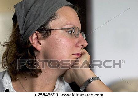 Stock Image - Polish woman deep in thought. Fotosearch