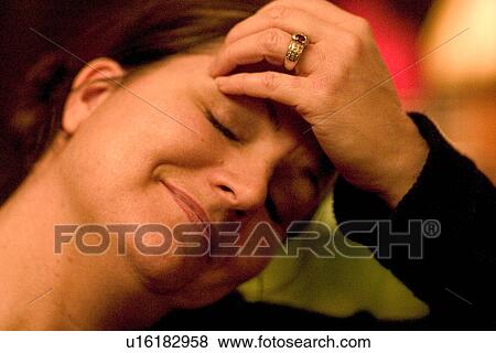 Stock Photo - Woman age 35 enjoying the moment. St Paul Minnesota USA. Fotosearch