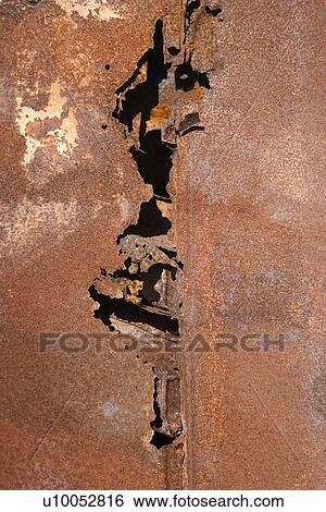 Close-up of old rusted car with crack down the middle. View Large Photo Image Stock Photograph - Close-up of old rusted car with crack down the middle.. Fotosearch