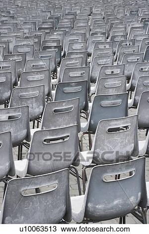 Stock Image - Close-up shot of several chairs in Saint Peter's Square in Vatican City, Italy. Fotosearch