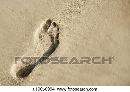 Picture - Footprint in sand.. Fotosearch