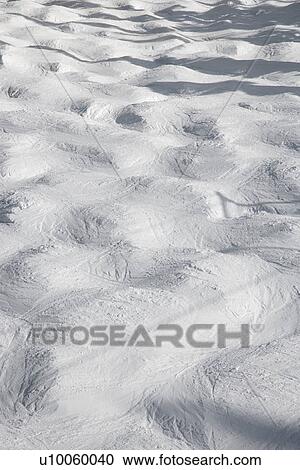 Stock Image - Mogul snow ski trail.. Fotosearch