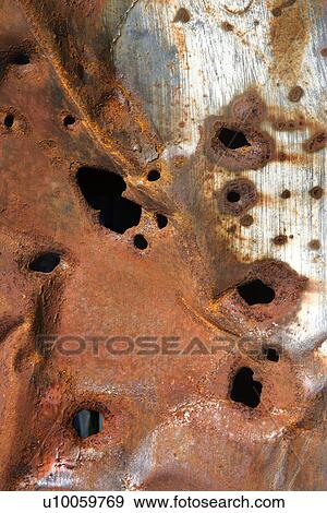 Old rusty metal with holes View Large Photo Image Stock Photo - Old rusty metal with holes. Fotosearch