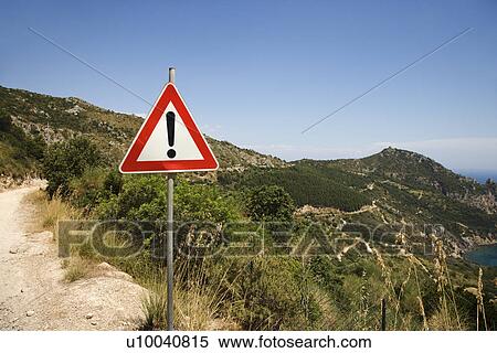 Caution sign on coastal dirt road. View Large Photo Image Stock Photography - Caution sign on coastal dirt road.. Fotosearch