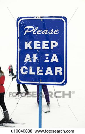 Sign at ski slope requesting area be kept clear. View Large Photo Image Stock Photo - Sign at ski slope requesting area be kept clear.. Fotosearch