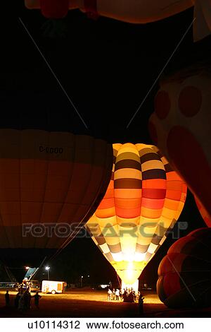 Stock Image - Gatineau Hot Air Balloon Festival, Quebec Canada -night glow. Fotosearch