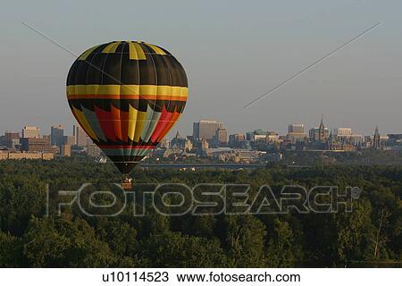 Stock Image - Gatineau Hot Air Balloon Festival, Quebec Canada-Ottawa sky line. Fotosearch