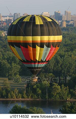 Stock Image - Gatineau Hot Air Balloon Festival, Quebec Canada with Ottawa skyline. Fotosearch