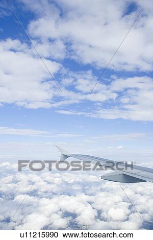 Stock Image - Clouded, Atmosphere, Climate, Bright, Blue Sky, Aircraft. Fotosearch