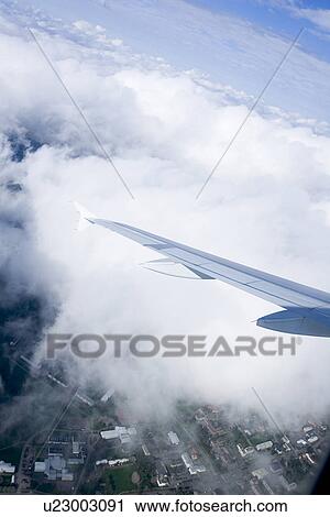 Clouded, Atmosphere, Climate, Bright, Blue Sky, Aircraft View Large Photo Image Stock Image - Clouded, Atmosphere, Climate, Bright, Blue Sky, Aircraft. Fotosearch
