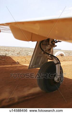 Stock Photograph - low section, airplane, wing. Fotosearch