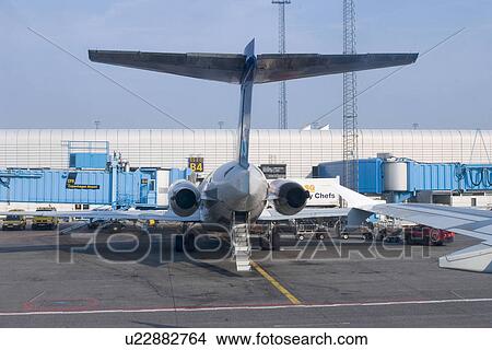 Picture - wings, hanger, tail, behind, aeroplane, airport. Fotosearch