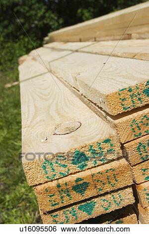 Stock Photograph - Beams, Building Material, Grass, Lumbering. Fotosearch