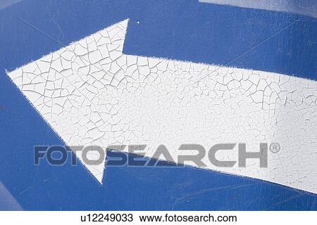 Stock Image - Arrow Sign, Cracked, Close-Up, Blue, Arrow. Fotosearch