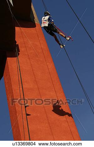 Picture - repelling, recreation, rescue, construction, grip, feet. Fotosearch