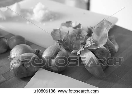 Stock Photograph - Black And White, Chopped, Close-Up, Covering, Cutting Board, Edible. Fotosearch
