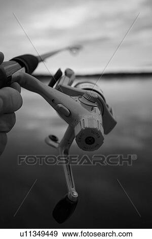 Stock Photo - Fishing Reel, Nature, Calm, Placid, Fishing, Marine. Fotosearch