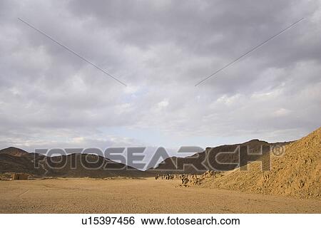 Stock Photograph - Arid Landscape, Cloudscape, Cloud, Brown, Arid Climate. Fotosearch