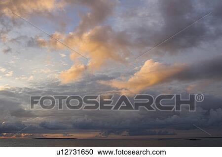 Stock Image - Cloud, Cloudscape, Cumulus Cloud, Dusk, Fluffy. Fotosearch