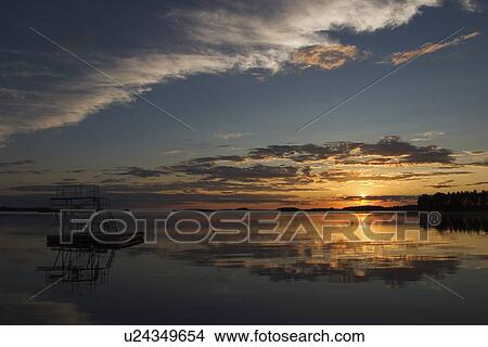 Clouds, Glow, Drowning, Dawn Dusk, Amber Light View Large Photo Image Picture - Clouds, Glow, Drowning, Dawn Dusk, Amber Light. Fotosearch