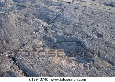 Stock Image - boulder, cracks, ancient. Fotosearch
