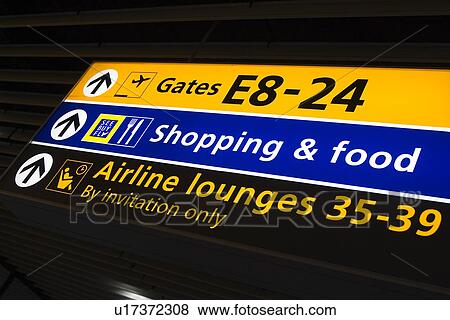 Stock Photo - Arrow Sign, Glow, Entrance, Directional Sign, Airport. Fotosearch