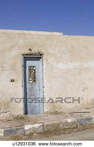 Stock Photograph - Closed, Blue, Clear Sky, Building Structure, Building Exterior, Adobe. Fotosearch