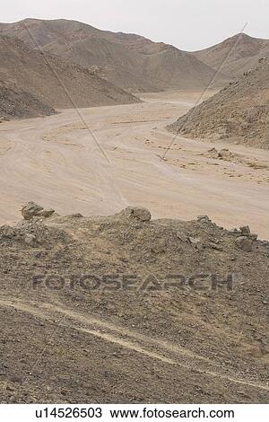 Stock Image - Barren, Brown, Day, Dirt Road, Extreme Terrain. Fotosearch