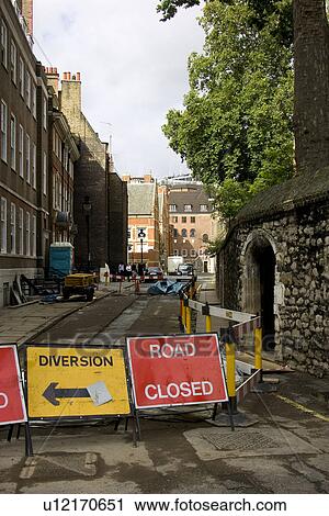 Stock Image - Cobblestone, Barricade, Building Structure, Building Exterior, Building, Arrow Sign. Fotosearch