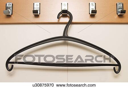 Stock Image - metal, empty, hanger, clothes hanger, implement, device. Fotosearch