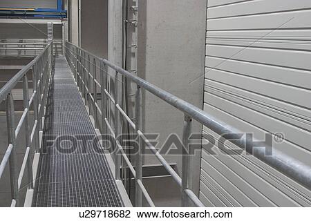 Stock Image - indoors, wall, rods, beams, rows, bridge. Fotosearch