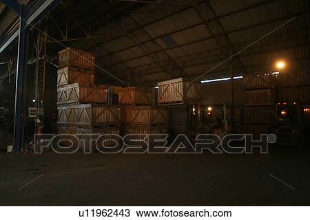 Stock Image - worker, working, effort, factory, warehouse, carrying. Fotosearch