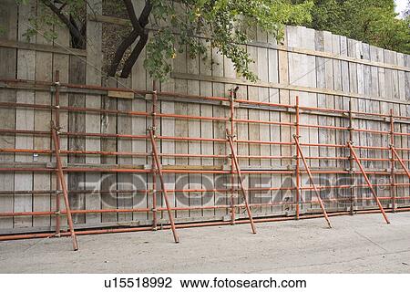 Stock Image - Day, Fence, Leaves, Metal. Fotosearch