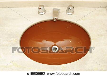 Stock Image - wash basin, hole, water. Fotosearch