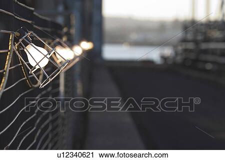 Stock Image - dark, gloomy, lit, lights, street, outdoors. Fotosearch