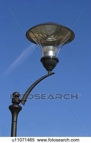 lamppost, lamp, glass, rod, close-up, clouds View Large Photo Image Stock Photography - lamppost, lamp, glass, rod, close-up, clouds. Fotosearch