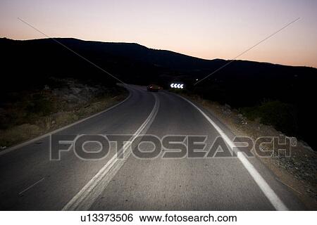 Stock Photograph - Car, Driving, Dusk, Highway, Hill. Fotosearch