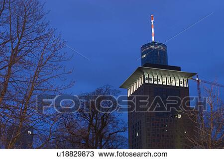 Stock Image - night, trees, buildings, light, lit, windows. Fotosearch